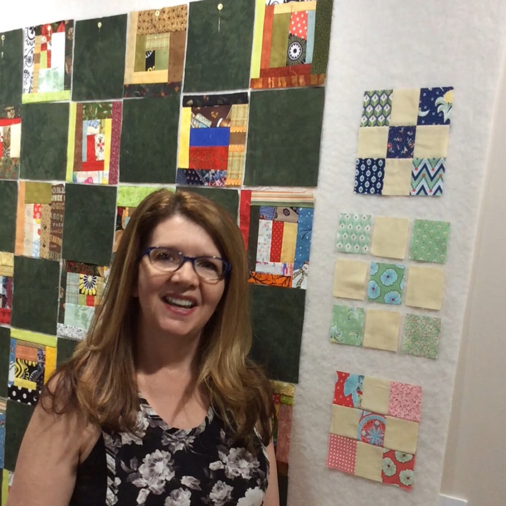 Clotheslining tutorial video with Paola Jo standing in front of a quilt board