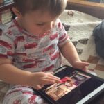 Boy watching one of Paola Jo's videos on iPad